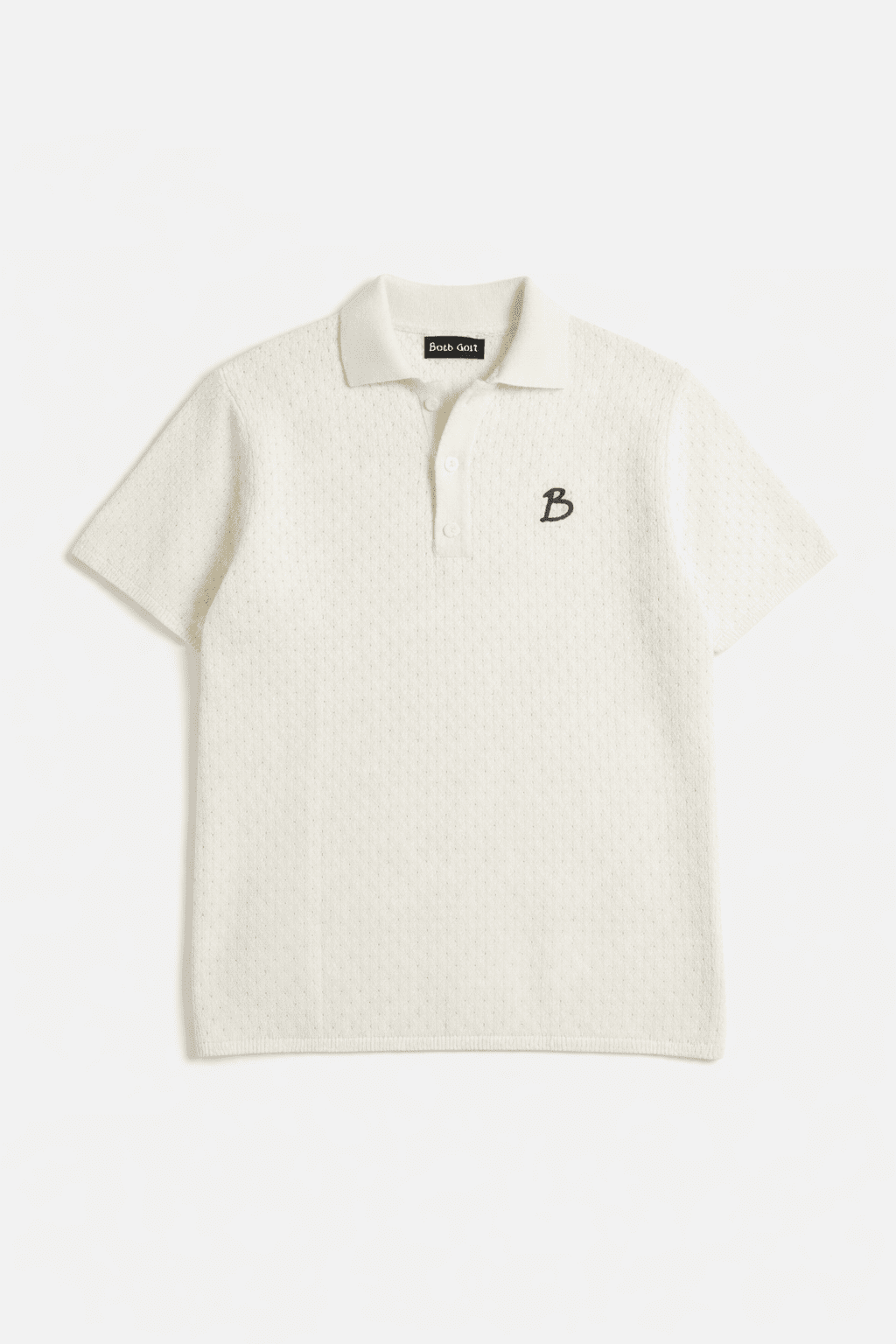 White polo shirt with a small logo on a white background